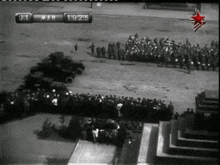 a black and white photo of a military parade with the date march 19th 1915