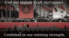 a large crowd of people are gathered in front of a red banner that says ddr