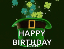 a green leprechaun hat with shamrocks coming out of it and the words `` happy birthday joan '' .