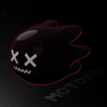 a black object with white crosses on it 's face