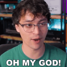 a man wearing glasses and a green shirt is saying oh my god