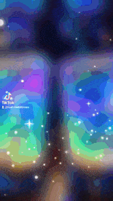 a colorful background with a tiktok logo on the bottom