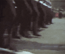 a blurry picture of a group of soldiers marching in a parade