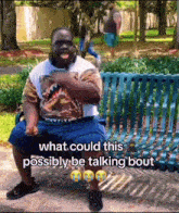 a man is sitting on a park bench with a caption that says what could this possibly be talking bout .