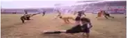 a group of people are playing soccer on a field .