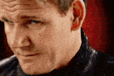 a close up of a man 's face with his eyes closed