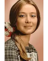 a woman with a flower in her hair is smiling