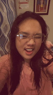 a girl wearing glasses has a picture of herself on the lenses
