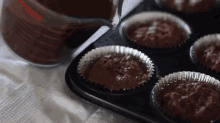 Pouring Chocolate Sauce Onto Cupcakes GIF