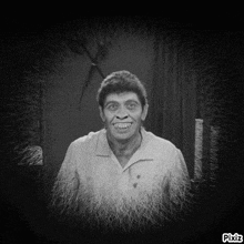 a black and white photo of a man with pixiz written on the bottom right corner