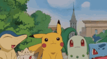 a group of pokemon standing next to each other with a building in the background