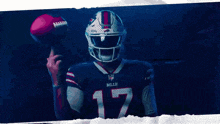 a man wearing a buffalo bills jersey is holding a football