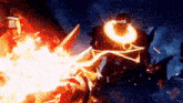 a video game character is being attacked by a giant robot with fire coming out of it .