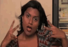 Mindy Throws Up The Deuces GIF
