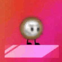 a cartoon character with a face and arms is standing on a pink surface .