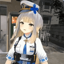 a girl in a police uniform has a blue flower in her hair .