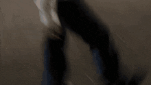 a blurry picture of a woman standing in a park at night