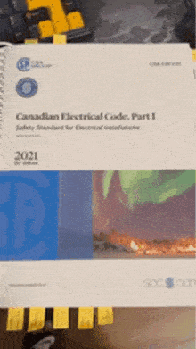 a book titled canadian electrical code part i is sitting on a table