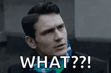 a man in a suit and scarf is making a funny face and saying what ?
