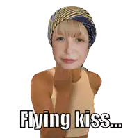 a girl with a scarf on her head says " flying kiss "