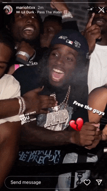 a screenshot of a group of people with the words free the guys