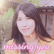 a picture of a woman with the words " missing you " below her