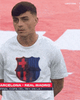 a man wearing a t-shirt that says fcbarcelona on it