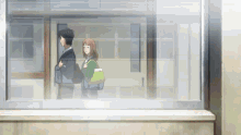 a man and a woman are walking through a doorway