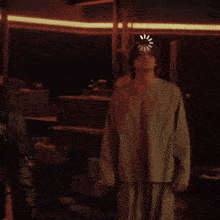 a man stands in a dark room with a loading bar on his head
