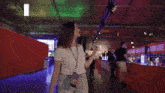 a woman with her arms outstretched in front of a sign that reads come to dreamhack