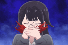 a girl with blood coming out of her mouth is covering her mouth with her hands