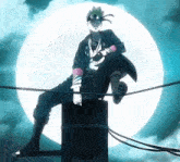 a man sitting on top of a pole with a full moon in the background