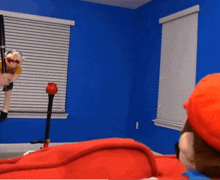 a puppet is hanging from a rope in a room .