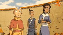 three cartoon characters are standing in front of a wall with nickelodeon written on it