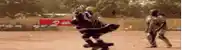 a blurred image of people playing a game with a sign that says airtel in the background
