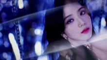 a close up of a woman 's face with the words blackpink on the bottom right
