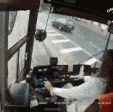 a woman is driving a bus with the date of 14.09.2017