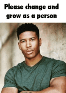 a man in a green shirt is standing with his arms crossed in front of a sign that says please change and grow as a person