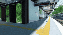 the number 2 is on the sign above the train platform