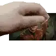 a close up of a person 's hand holding something in front of a man .