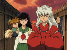 a group of anime characters standing next to each other with one making a face