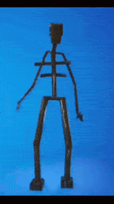 a wooden skeleton with arms and legs against a blue backdrop