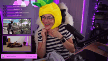 a woman wearing a pineapple hat on a twitch stream