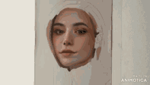 a painting of a woman 's face is being made in animotica