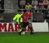 a soccer player in a red jersey with the number 10 on the back