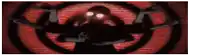 a silhouette of a person with red eyes in a circle on a brick wall .