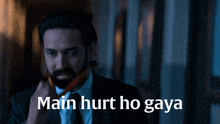 a man in a suit and tie with the words main hurt ho gaya