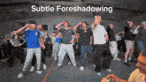 a group of people are dancing in a room with the words subtle foreshadowing below them