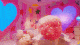 a stuffed animal is laying on a bed in a room with a heart shaped window .