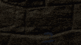 a computer generated image of a person standing in front of a stone wall